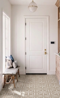 Beginning pattern tiled hallway floor
